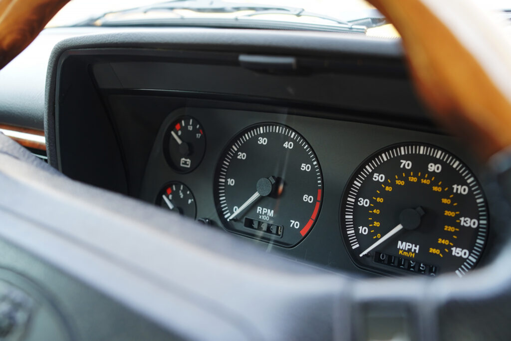 Dashboard view showing classic car tachometer reading 3500 RPM and speedometer in mph near 10, relevant for vintage vehicle enthusiasts