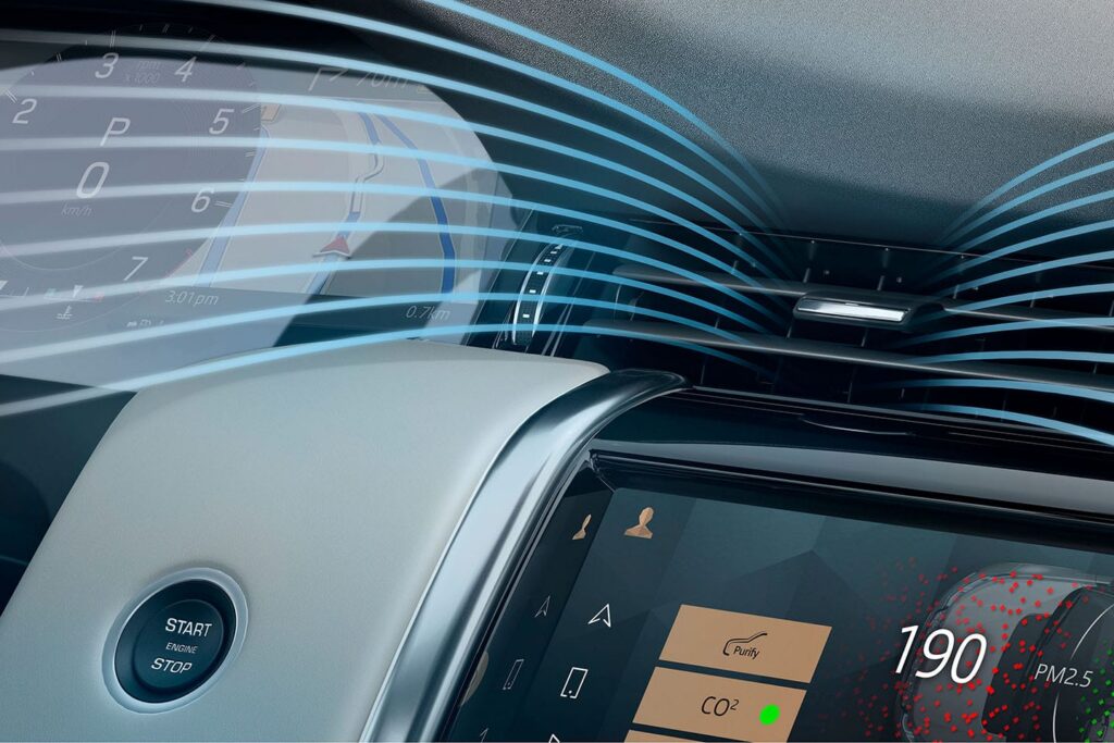 Dashboard view of car air purifier system showing airflow direction and digital display with air quality readings